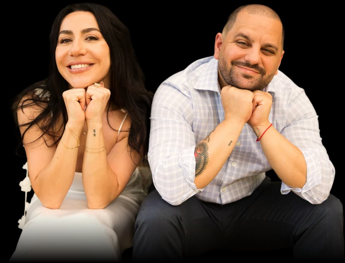 The couple sitting together, smiling